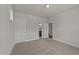Neutral carpeted bedroom with doorway to bathroom at 1245 Porters Call Dr, Wendell, NC 27591