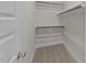 Walk in closet featuring built in shelving at 1245 Porters Call Dr, Wendell, NC 27591