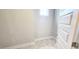 Walk-in closet with marble tile flooring, one window, and white trim at 1245 Porters Call Dr, Wendell, NC 27591