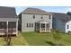 A detailed exterior shot of home's patio overlooking a lawn at 1245 Porters Call Dr, Wendell, NC 27591