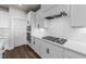 Contemporary kitchen with stainless steel appliances, white subway tile backsplash, and wood-style flooring at 1245 Porters Call Dr, Wendell, NC 27591