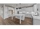 A bright kitchen with white cabinets, an island, and stainless appliances at 1245 Porters Call Dr, Wendell, NC 27591
