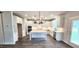 Modern kitchen with large center island, stainless steel appliances, and ample storage space, perfect for cooking and entertaining at 1245 Porters Call Dr, Wendell, NC 27591
