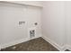 Neat laundry room with gray hexagon tiles at 1245 Porters Call Dr, Wendell, NC 27591