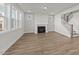 Bright living room features a fireplace and staircase at 1245 Porters Call Dr, Wendell, NC 27591