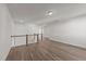 Upstairs loft with hardwood flooring and neutral paint at 1245 Porters Call Dr, Wendell, NC 27591