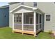 A detailed exterior shot of the home's enclosed patio at 1245 Porters Call Dr, Wendell, NC 27591