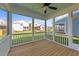 Relaxing screened-in porch with wooden floors and neighborhood views at 1245 Porters Call Dr, Wendell, NC 27591