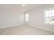 Bright room with plush carpeting and multiple windows overlooking the exterior at 1245 Porters Call Dr, Wendell, NC 27591