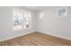 Bright room with wood flooring and windows showing the neighborhood at 1245 Porters Call Dr, Wendell, NC 27591