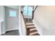 Staircase featuring hardwood steps and natural light, providing access to the home's upper level at 1245 Porters Call Dr, Wendell, NC 27591