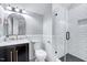Modern bathroom with stylish vanity, sleek fixtures, and a walk-in shower with white subway tile at 1309 Pecora Ln, Raleigh, NC 27607