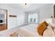 Comfortable bedroom featuring a bed, double closets with doors and stylish window at 1309 Pecora Ln, Raleigh, NC 27607