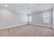 Empty bedroom featuring carpet and lots of natural light from the two windows at 1309 Pecora Ln, Raleigh, NC 27607