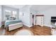 Cozy bedroom featuring lots of natural light, hardwood floors, and a comfortable bed at 1309 Pecora Ln, Raleigh, NC 27607
