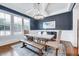 Formal dining room with wainscotting, a modern chandelier, and ample natural light at 1309 Pecora Ln, Raleigh, NC 27607