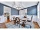 Elegant dining room featuring coffered ceilings, stylish lighting, and a beautiful hardwood floor at 1309 Pecora Ln, Raleigh, NC 27607