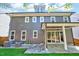 Beautiful home exterior showing covered patio, sliding glass doors, and well-kept landscaping at 1309 Pecora Ln, Raleigh, NC 27607
