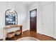 Elegant foyer with hardwood floors, decorative mirror, and a glimpse of the home's interior at 1309 Pecora Ln, Raleigh, NC 27607