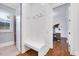 Hallway with a built-in bench, hooks, and a doorway leading to a study at 1309 Pecora Ln, Raleigh, NC 27607