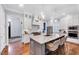 Modern kitchen boasts marble countertops, a center island with seating, and ample cabinet space at 1309 Pecora Ln, Raleigh, NC 27607