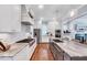 Bright kitchen featuring marble countertops, stainless steel appliances, and an eat-in island at 1309 Pecora Ln, Raleigh, NC 27607