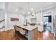 Gourmet kitchen with marble countertops, an island with seating, and stainless steel appliances at 1309 Pecora Ln, Raleigh, NC 27607
