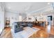 Spacious living room with an open floor plan, hardwood floors, and a view of the kitchen at 1309 Pecora Ln, Raleigh, NC 27607