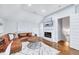 Comfortable living room featuring a fireplace, plush seating, and TV at 1309 Pecora Ln, Raleigh, NC 27607
