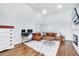Comfortable living room with modern decor, plush seating, and a cozy fireplace at 1309 Pecora Ln, Raleigh, NC 27607