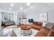Cozy living room featuring lots of natural light, hardwood floors, and comfortable seating at 1309 Pecora Ln, Raleigh, NC 27607