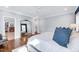 Elegant main bedroom with a large mirror, hardwood floors, and natural light at 1309 Pecora Ln, Raleigh, NC 27607