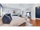 Elegant main bedroom with a large mirror, hardwood floors, and natural light at 1309 Pecora Ln, Raleigh, NC 27607