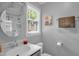 Bathroom featuring a modern sink, a framed mirror, and a shower with marble surround at 1487 Kentucky Ave, Sanford, NC 27332