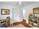 Cozy bedroom featuring built-in shelving, a desk, and a neutral color palette at 1487 Kentucky Ave, Sanford, NC 27332