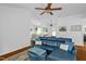 Open-concept living room with hardwood floors and access to both the dining area and the front entry at 1487 Kentucky Ave, Sanford, NC 27332