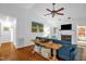 Cozy living room features a fireplace, vaulted ceiling, and beautiful hardwood floors at 1487 Kentucky Ave, Sanford, NC 27332