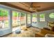 Inviting sunroom with sliding glass doors leading to backyard and tiled floor at 1487 Kentucky Ave, Sanford, NC 27332