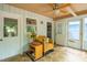 Relaxing sunroom with tile floor and a bright interior and natural light at 1487 Kentucky Ave, Sanford, NC 27332