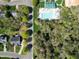 An aerial view of a community pool and clubhouse, surrounded by lush greenery and well-maintained landscaping at 1500 St Andrews Dr, Mebane, NC 27302