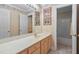 Bathroom with a long vanity, sink, and a large mirror at 1500 St Andrews Dr, Mebane, NC 27302