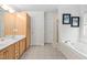 Bright bathroom with double vanity, soaking tub and private shower at 1500 St Andrews Dr, Mebane, NC 27302