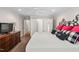 Bedroom with a large dresser, comfortable king bed and natural lighting at 1500 St Andrews Dr, Mebane, NC 27302