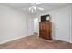Bedroom featuring a ceiling fan, carpet, and a wood dresser at 1500 St Andrews Dr, Mebane, NC 27302