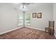 Bedroom with neutral paint, carpet, and two large windows at 1500 St Andrews Dr, Mebane, NC 27302