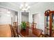 Spacious dining room with a large table, traditional decor, and ample natural light at 1500 St Andrews Dr, Mebane, NC 27302