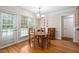Bright dining area features hardwood floors, neutral walls, and a beautiful view of the outdoors at 1500 St Andrews Dr, Mebane, NC 27302