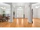 Grand foyer with gleaming hardwood floors, arched entryway, and elegant lighting fixture at 1500 St Andrews Dr, Mebane, NC 27302