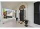Attractive front porch featuring an arched front door, a porch swing, and classic black shutters at 1500 St Andrews Dr, Mebane, NC 27302