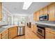 Bright eat-in kitchen with stainless steel appliances and adjacent dining area at 1500 St Andrews Dr, Mebane, NC 27302